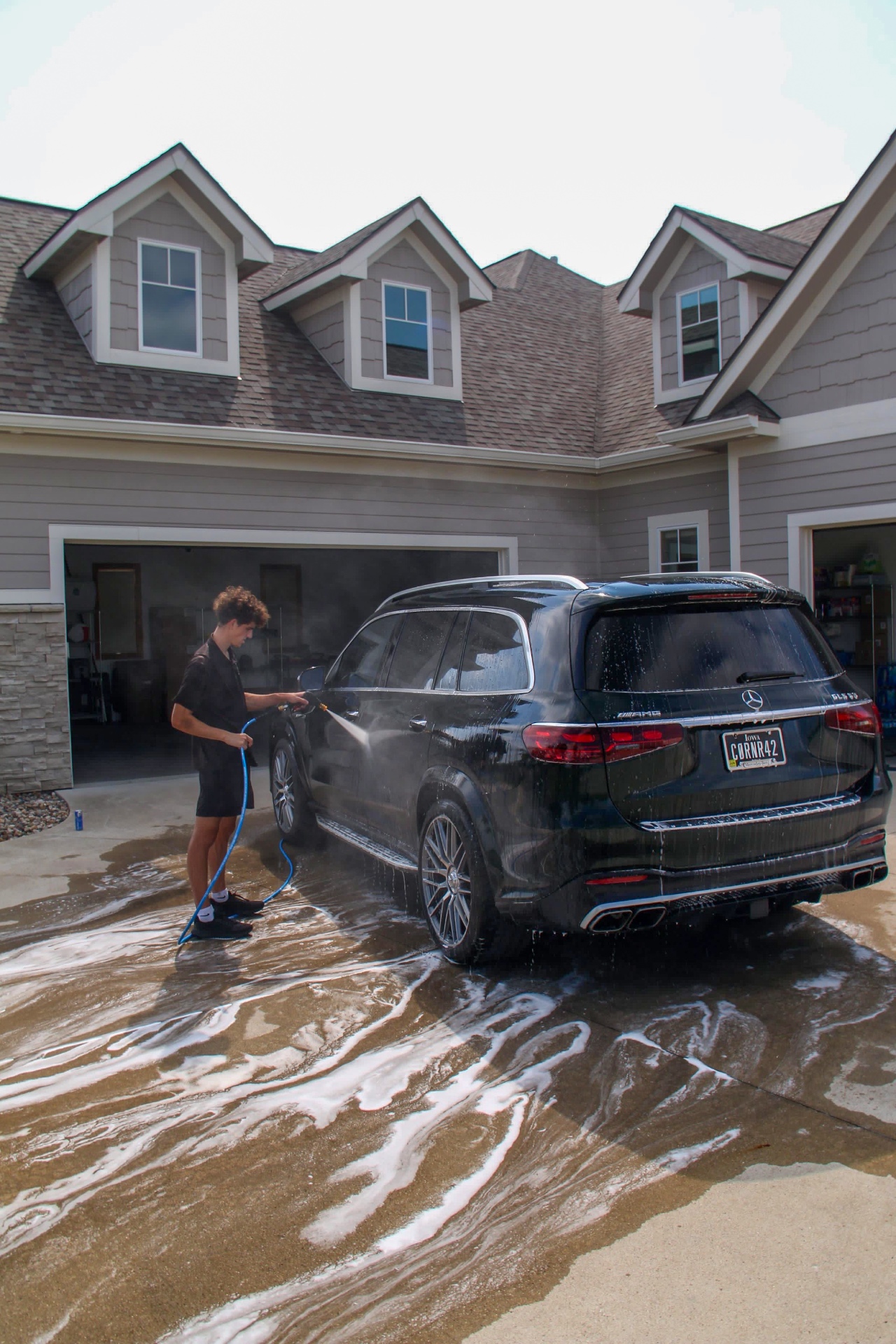 Jake washing a Mercedes-AMG GLS 63 during a mobile detail