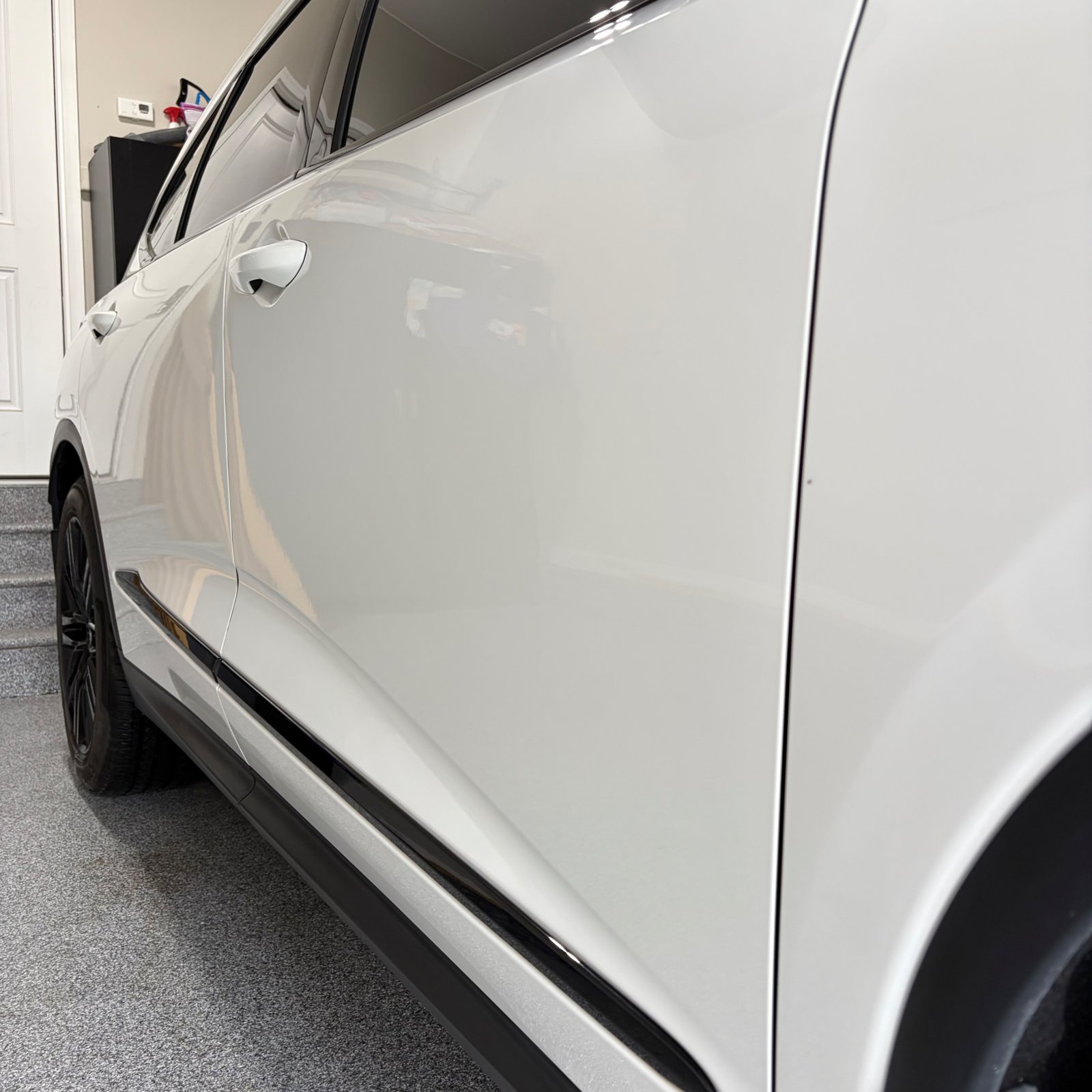 Gloss on the Acura MDX door panel after coating