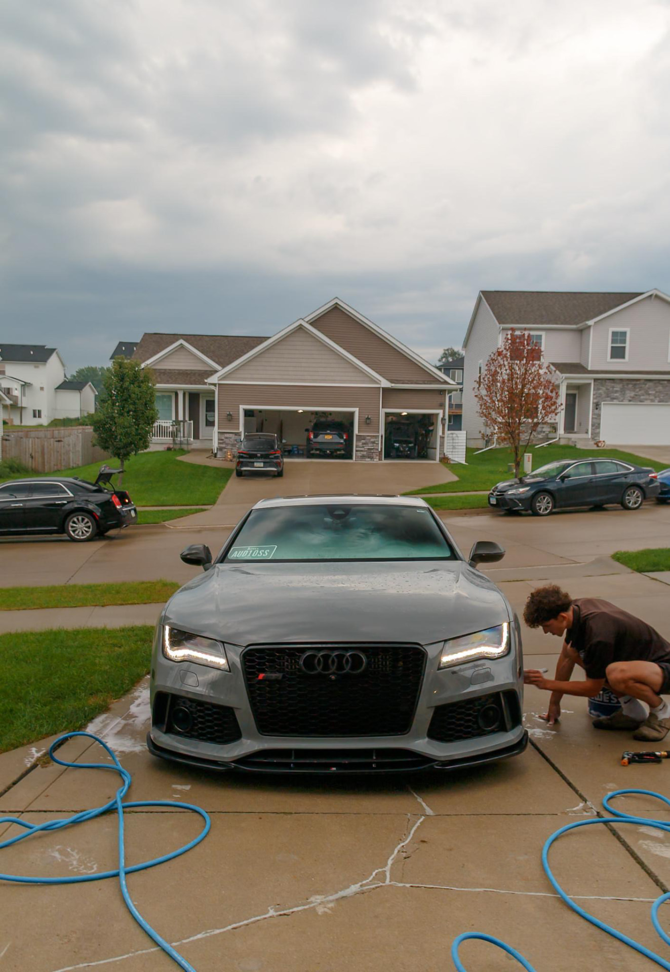Street Standard performing paint correction on an Audi RS7 in a driveway