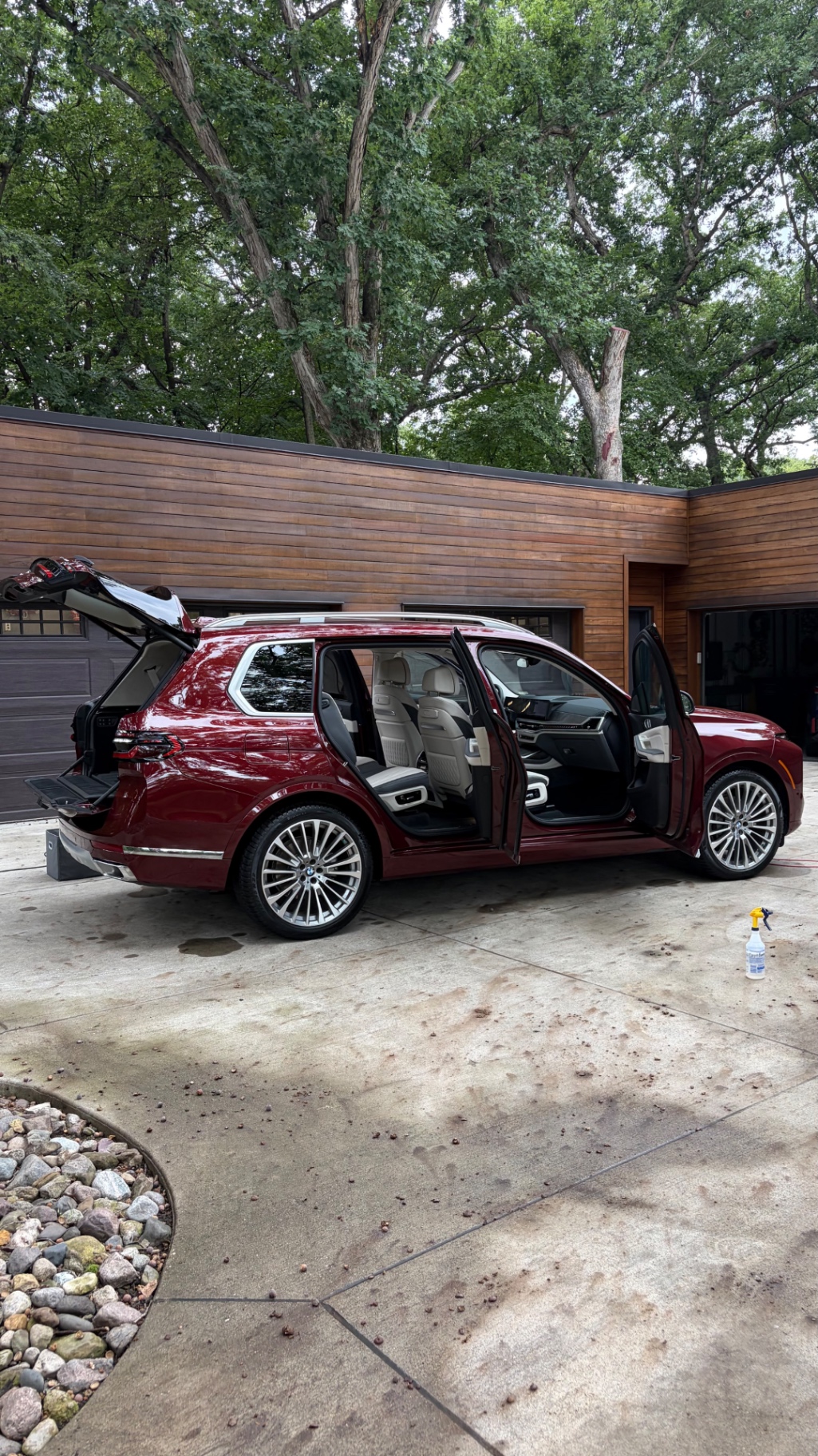 BMW X7 with doors open during a mobile interior detail