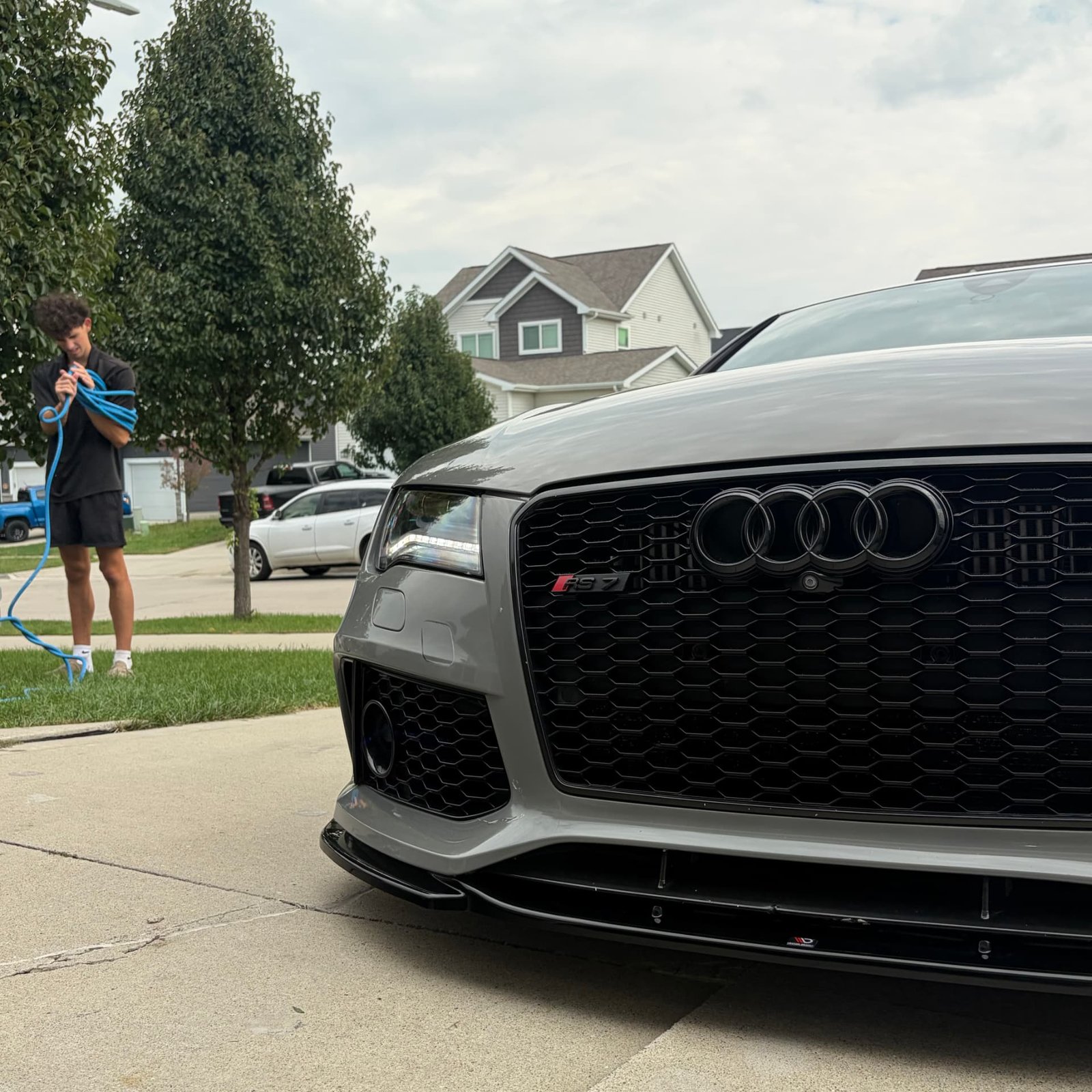 Corrected grille and front splitter on a Nardo Grey Audi RS7