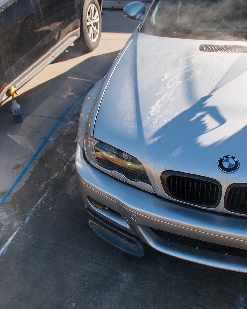 BMW E46 M3 hood being cleaned during its exterior detail