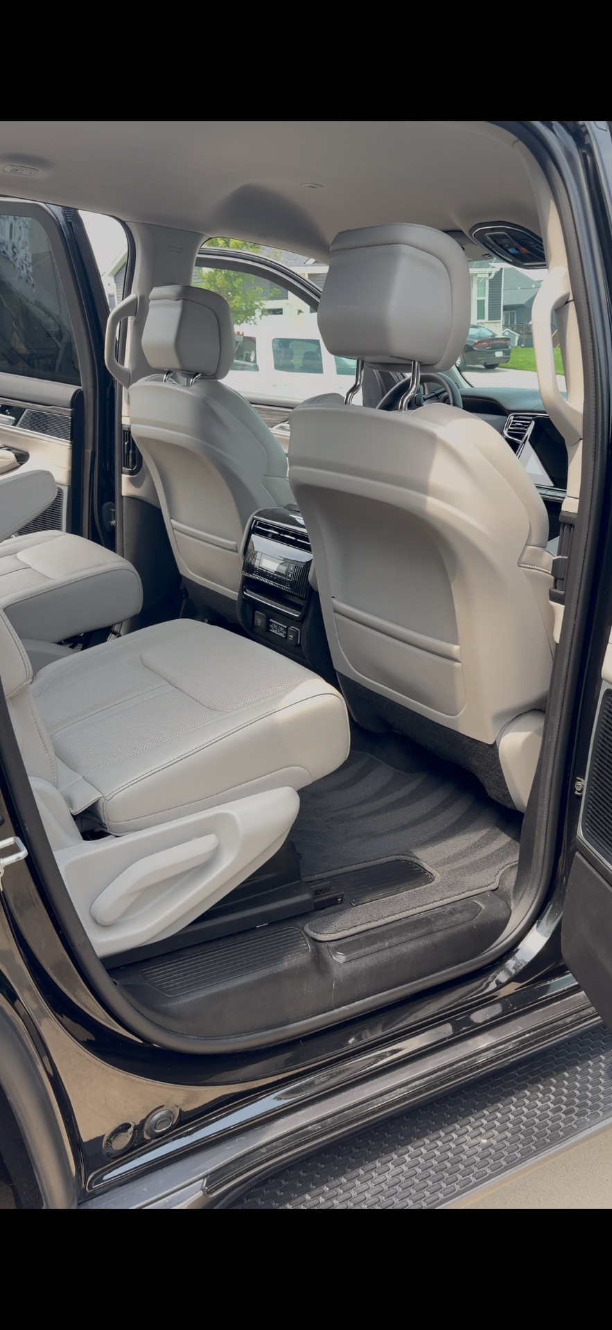 Rear cabin of a matte wrap Jeep Grand Wagoneer detailed in the Des Moines metro
