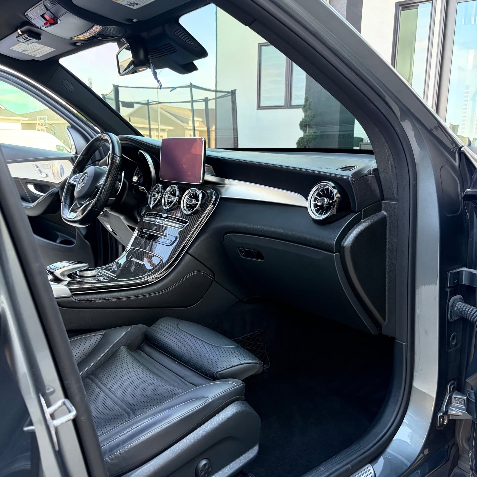 Detailed passenger cabin and carbon center console of the Mercedes-AMG GLC 63