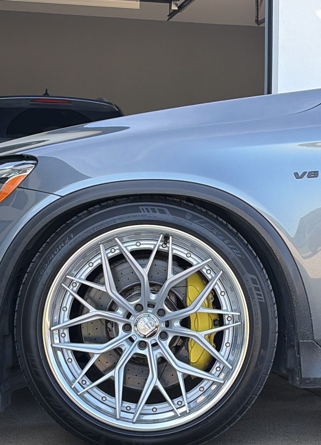 Clean AL13 wheel and yellow brake caliper on the Mercedes-AMG GLC 63
