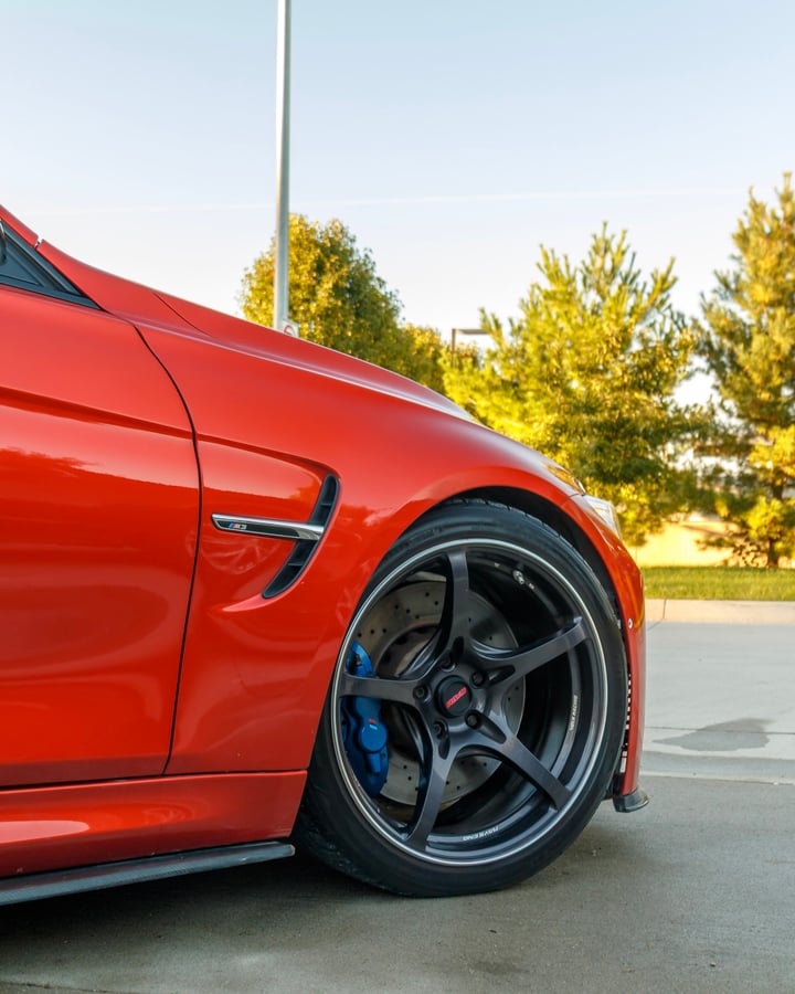 Orange BMW front wheel and fender photographed by Kenny