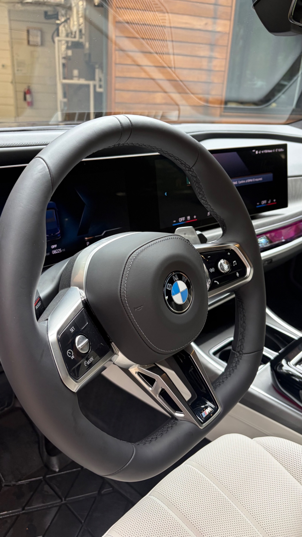 Steering wheel and dash detail in a BMW M760i xDrive
