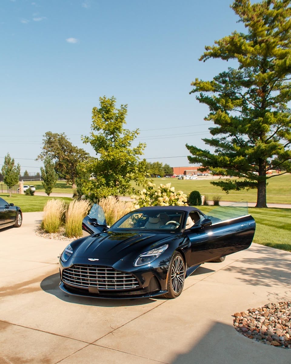 Aston Martin DB12 Volante with doors open after a mobile detail