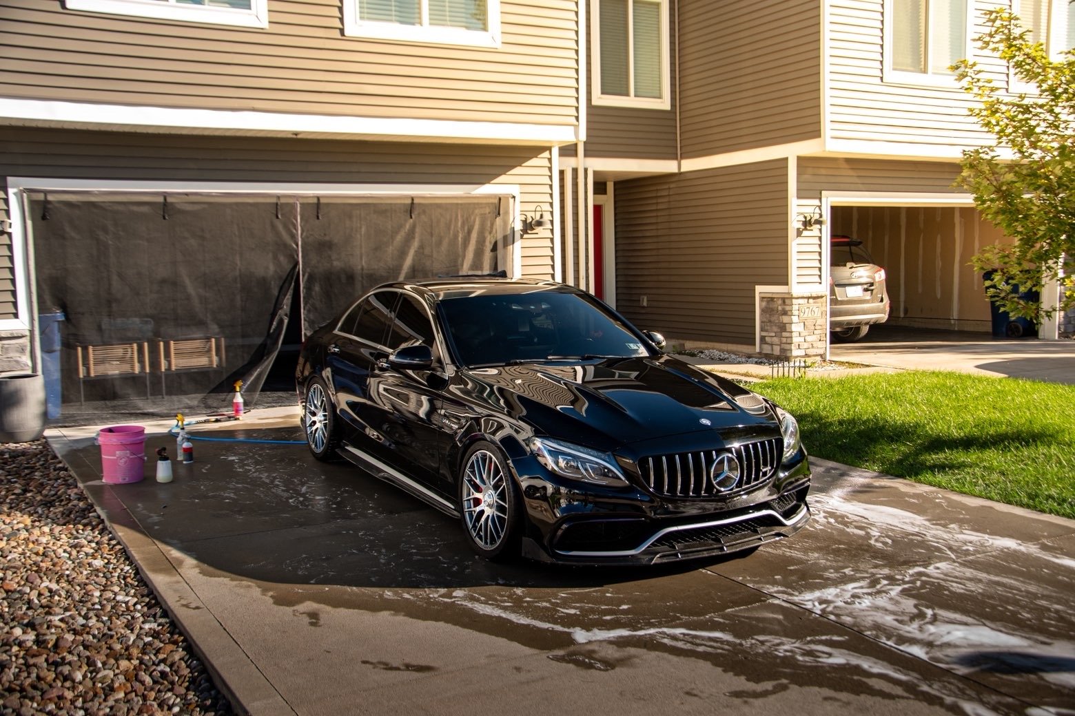 Black Mercedes-AMG C 63 S in the driveway after an exterior detail in Waukee