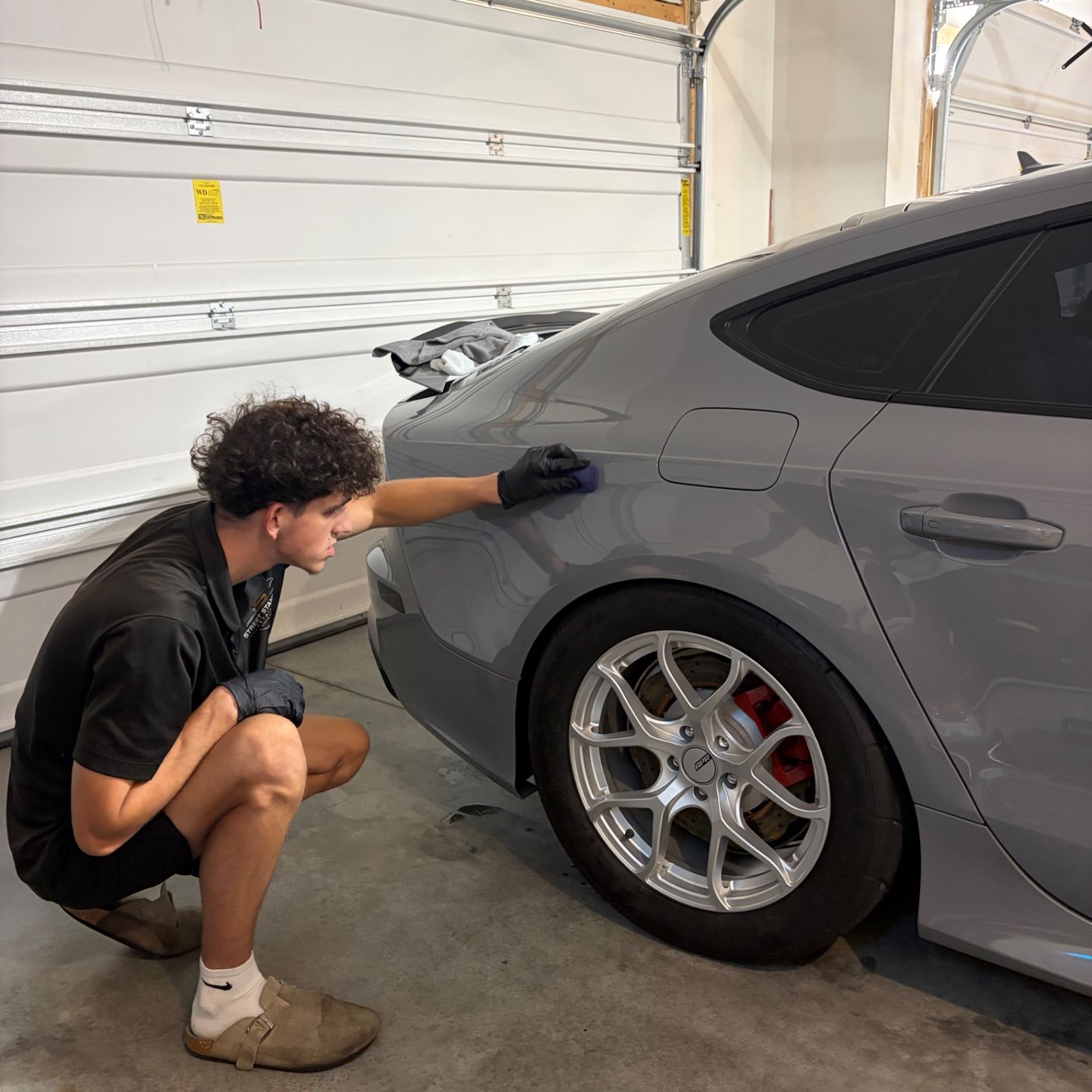 Inspecting the finish on an Audi RS7