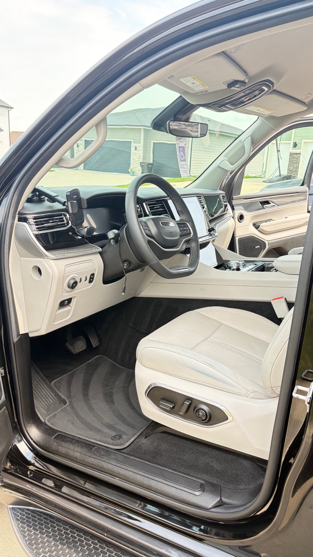 Front cabin of a matte wrap Jeep Grand Wagoneer after an interior detail in Ankeny, Iowa