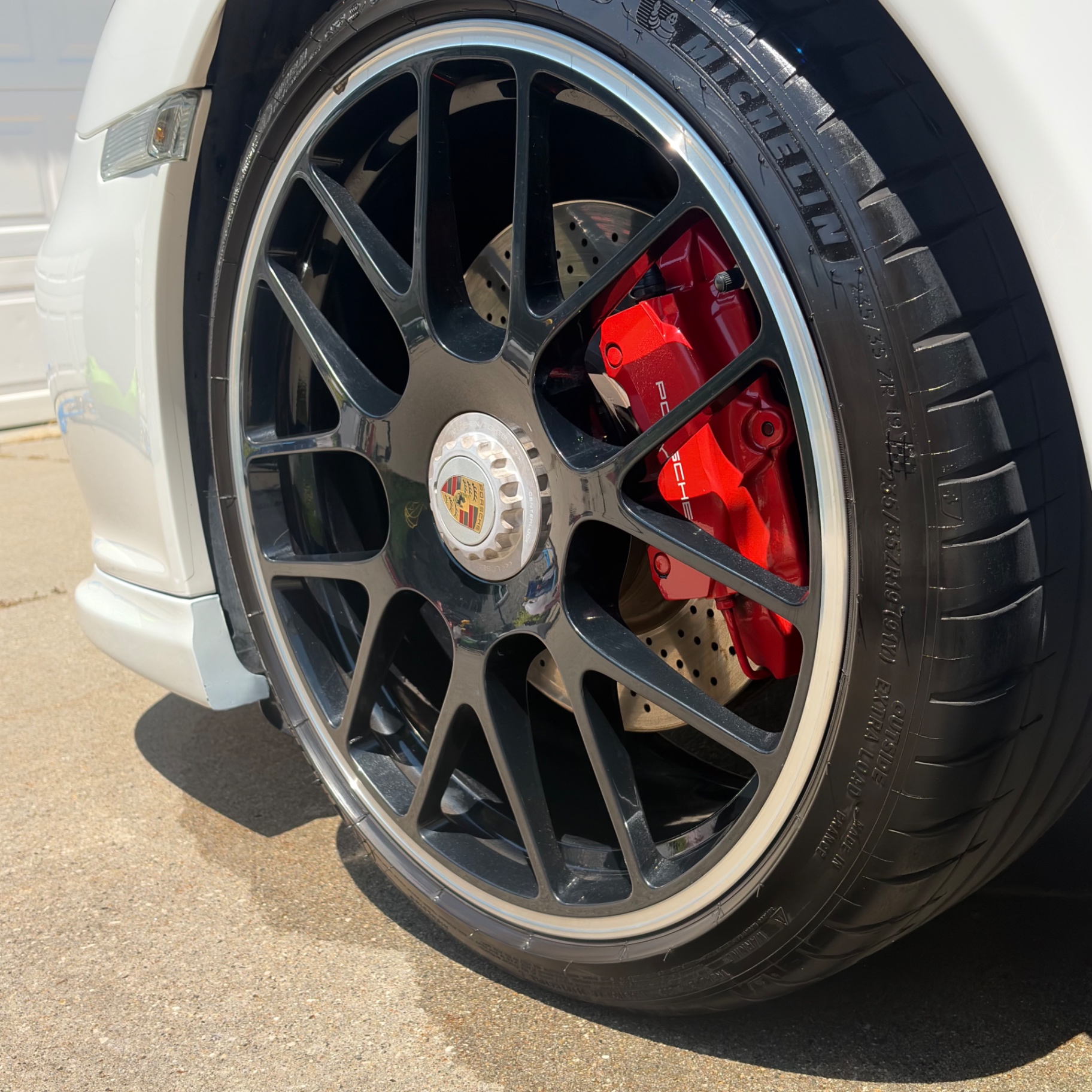 Cleaned wheel and brake on a Porsche 911 Carrera GTS