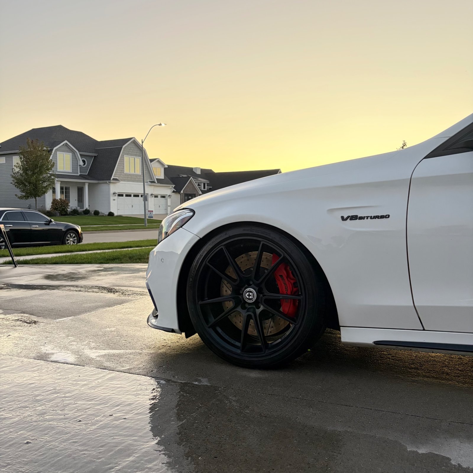 HRE front wheel and red AMG caliper on the white C 63 S after the detail
