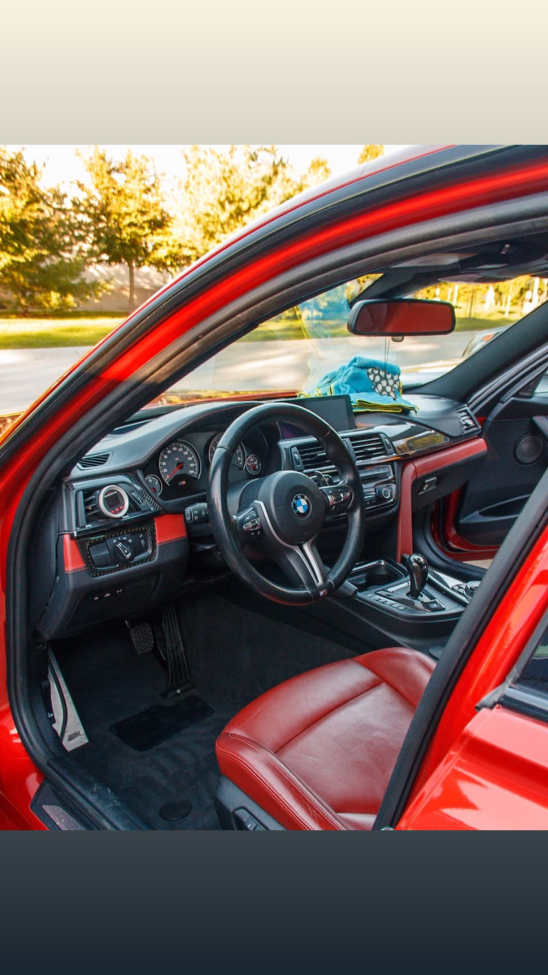 Clean red and black interior of the BMW F80 M3 after its maintenance detail
