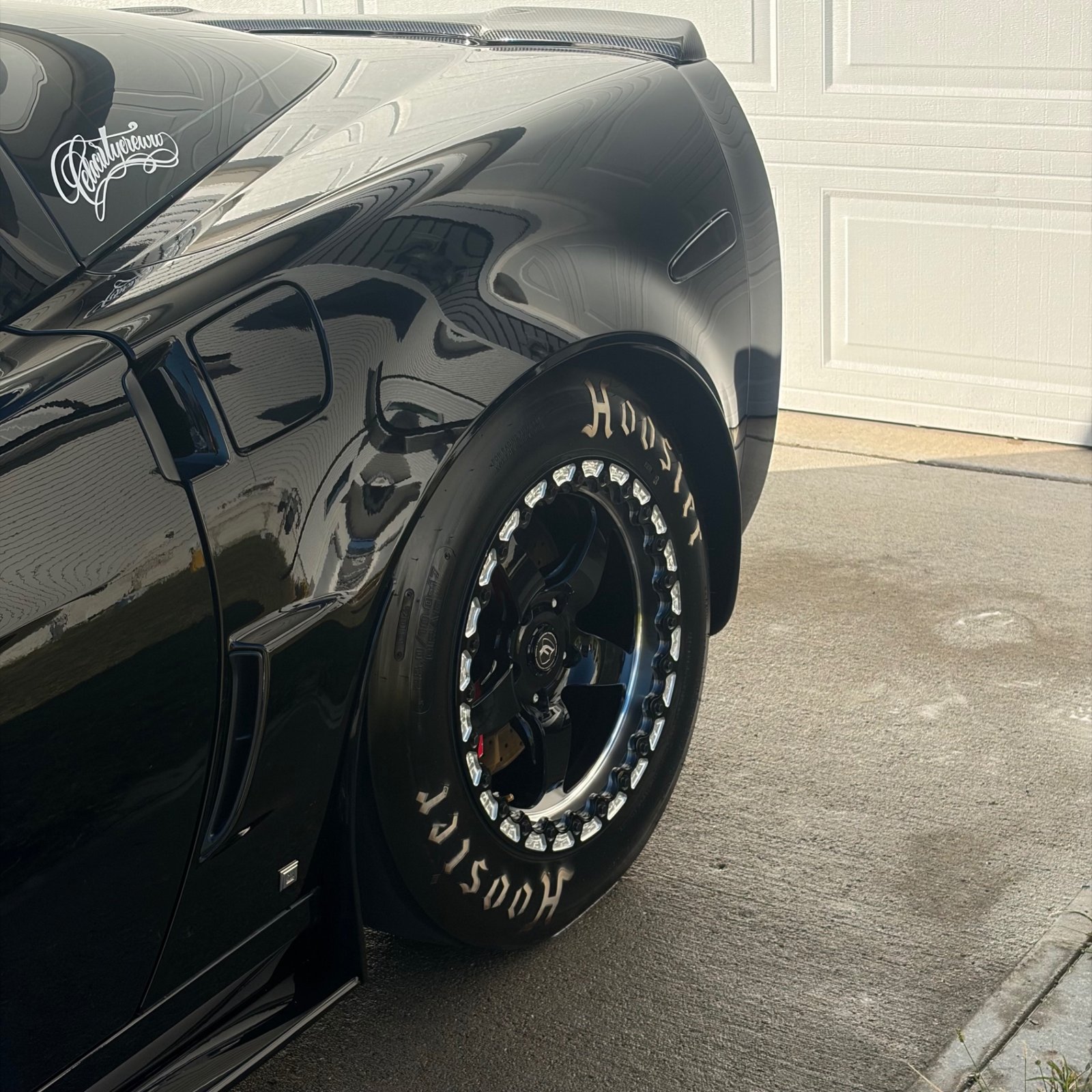 Hoosier drag wheel closeup on the black Corvette C6 Z06 in Urbandale