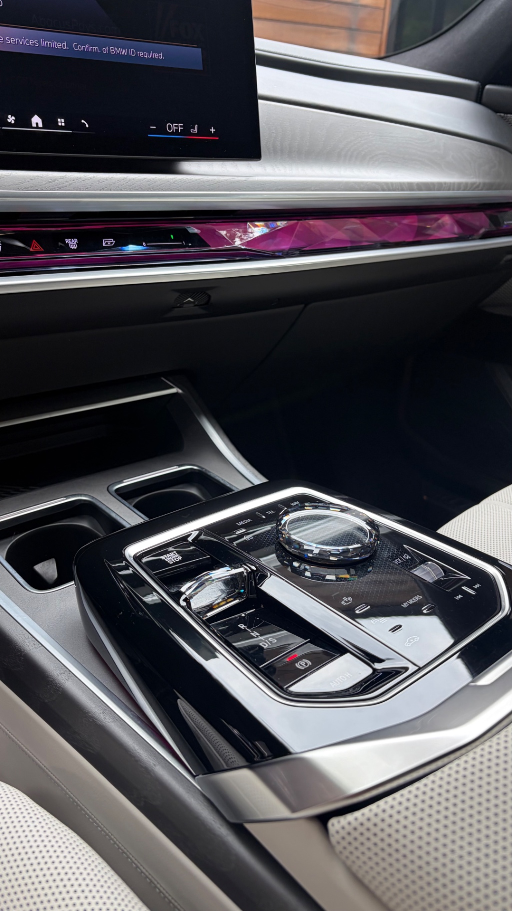 Crystal center console controls in a BMW M760i xDrive after interior detailing