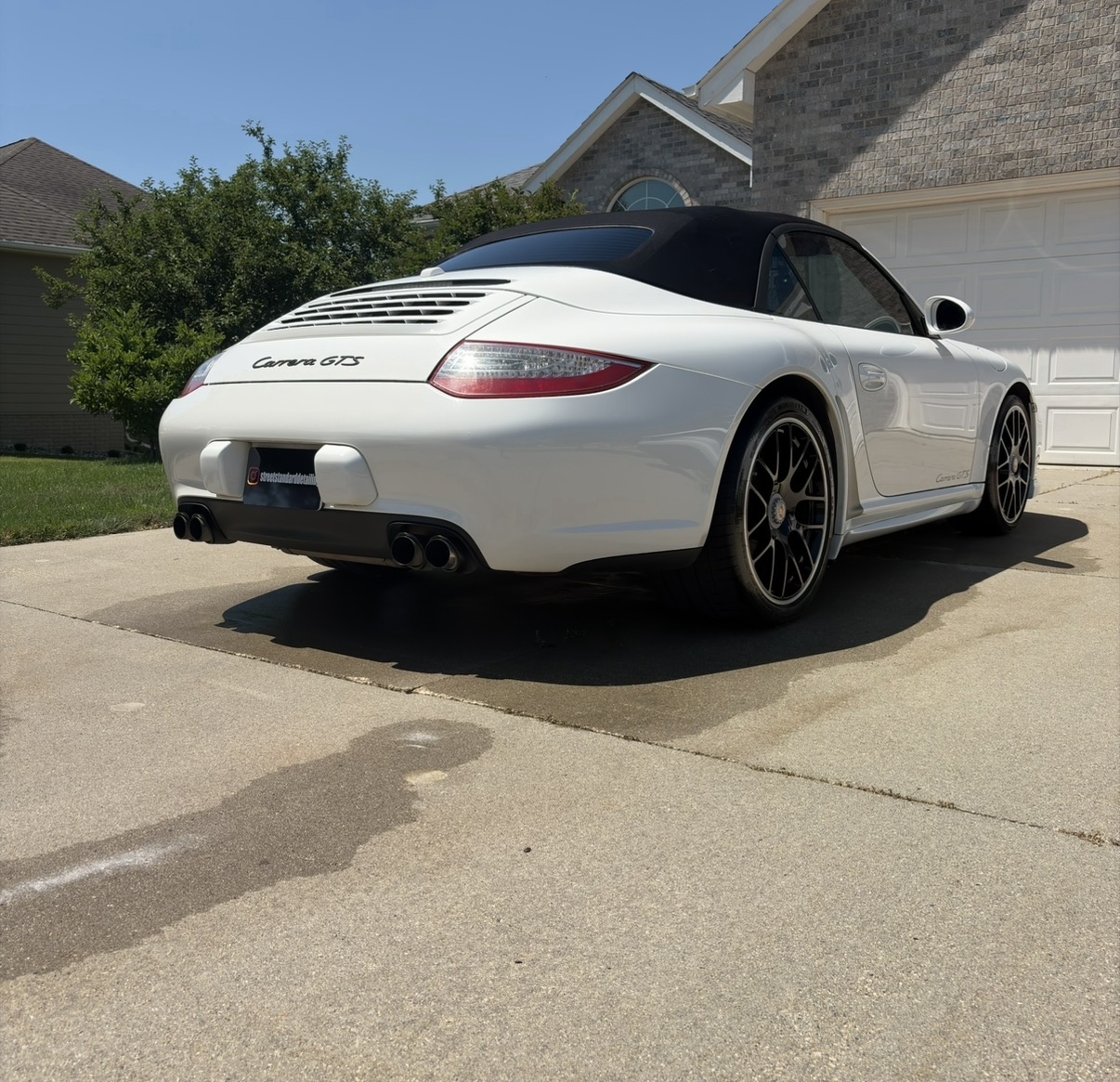 Rear quarter of a Porsche 911 Carrera GTS Cabriolet after detailing