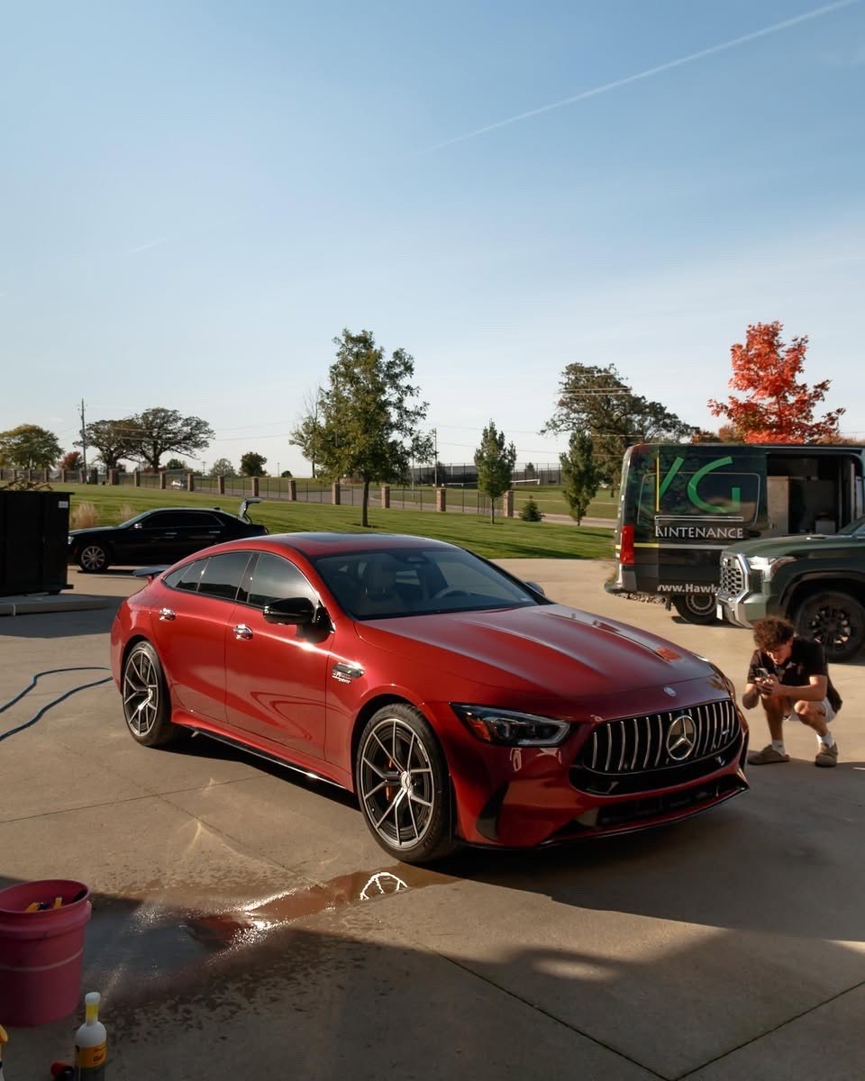 Jake photographing the red Mercedes-AMG GT 63 S during its mobile detail