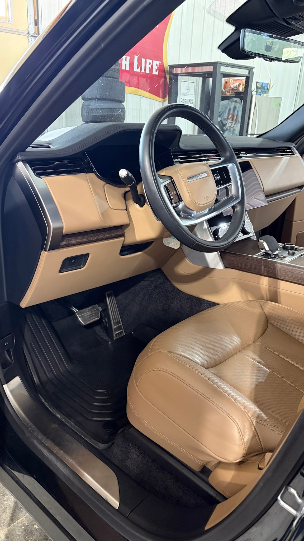 Range Rover tan leather interior after a full detail in West Des Moines