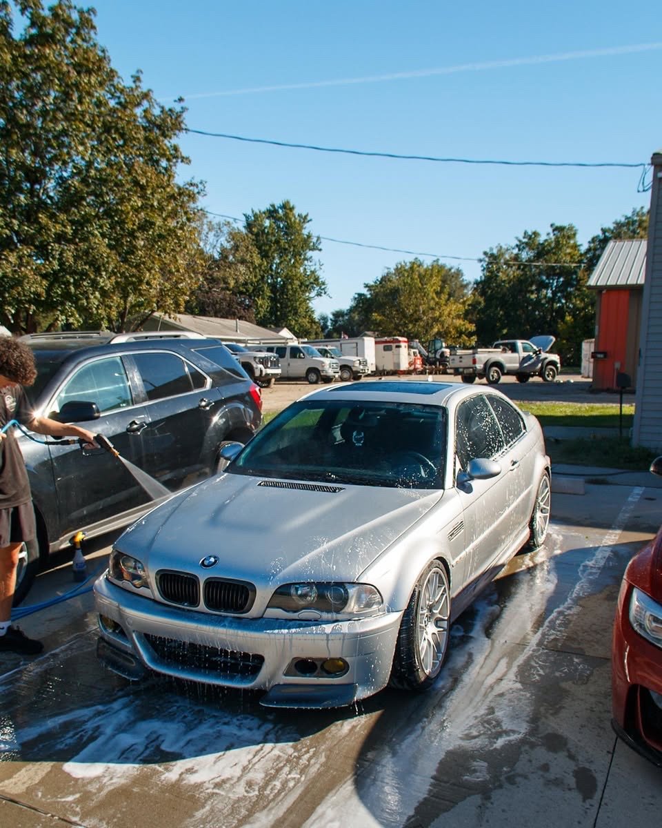 Silver BMW E46 M3 being washed during an exterior detail in Waukee