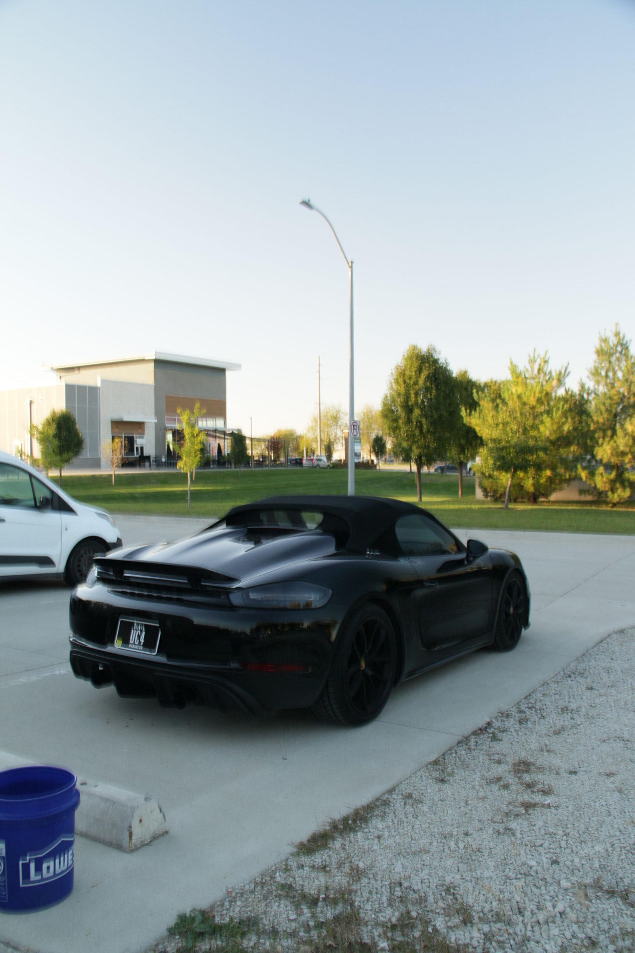 Black Porsche 718 Spyder rear quarter after an exterior detail in Waukee
