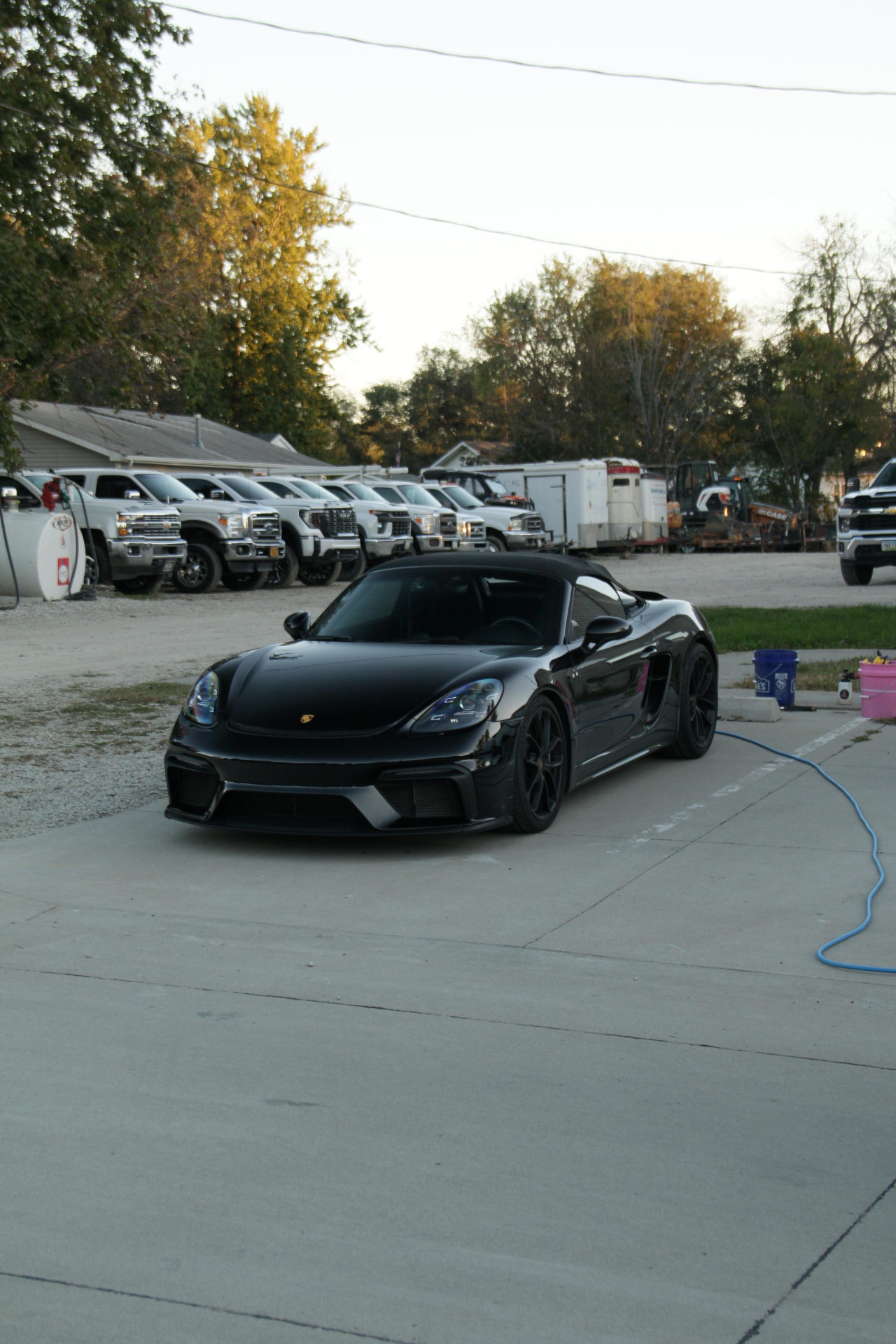 Black Porsche 718 Spyder front quarter after an exterior detail in Waukee
