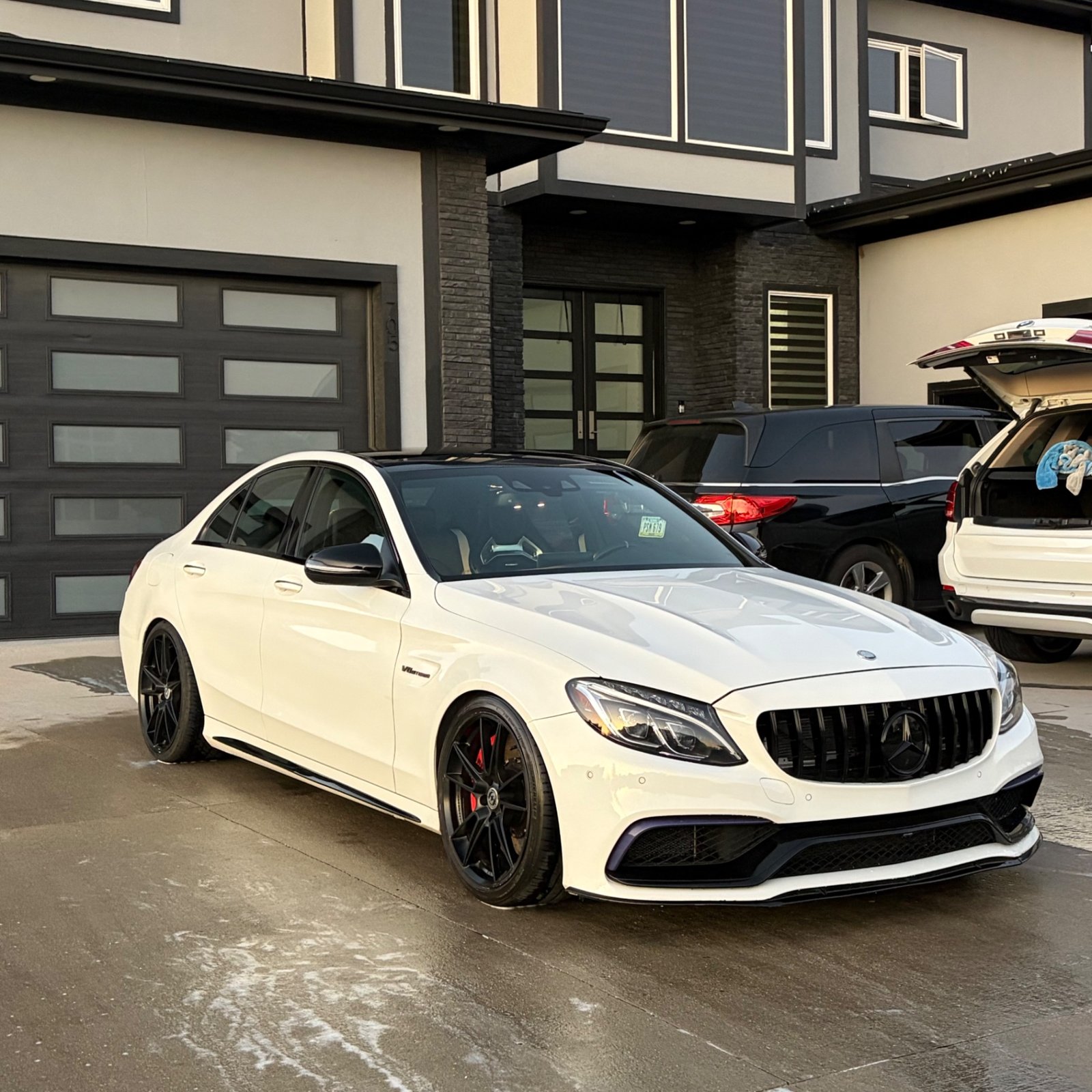 White Mercedes-AMG C 63 S on HRE wheels after an exterior detail in Waukee