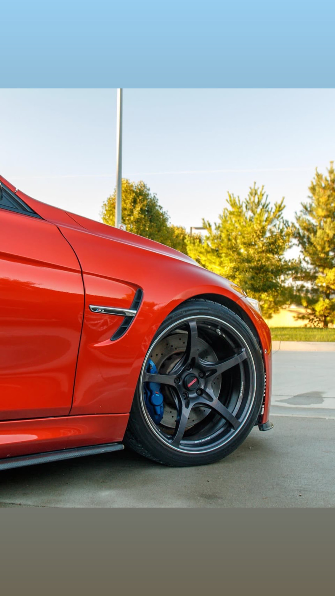 Front wheel and brake detail on the red BMW F80 M3