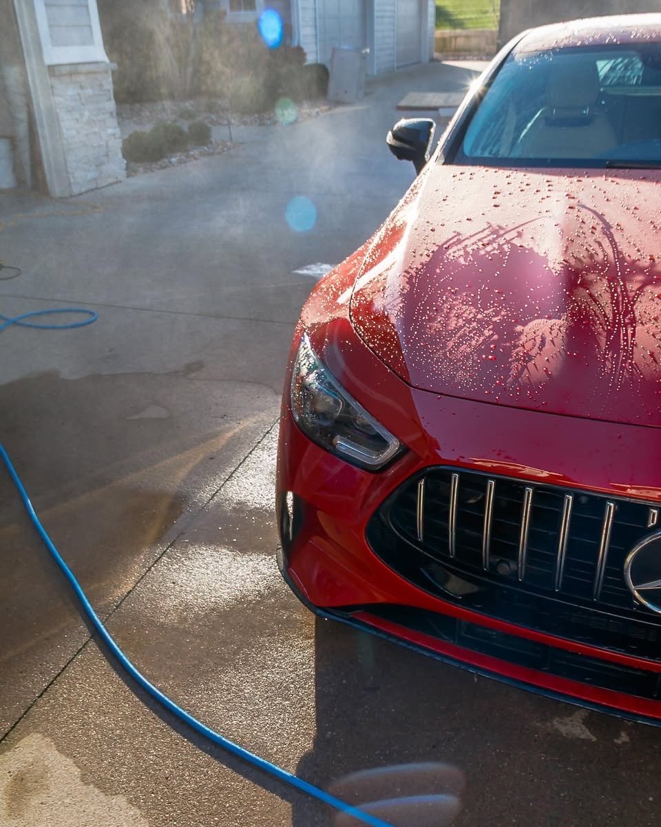 Water beading on the red Mercedes-AMG GT 63 S hood after the rinse