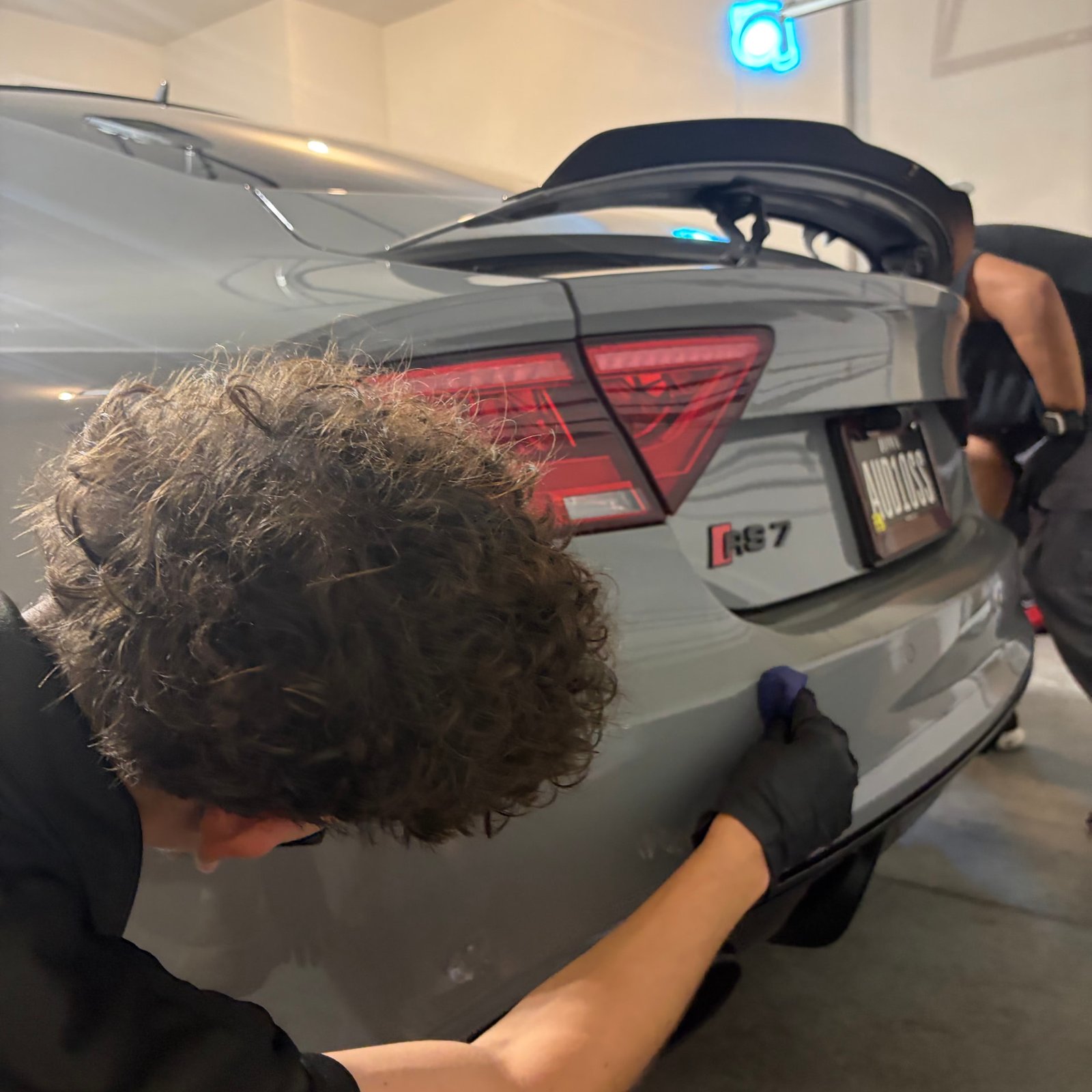 Jake levelling GYEON MOHS EVO on the Audi RS7 rear