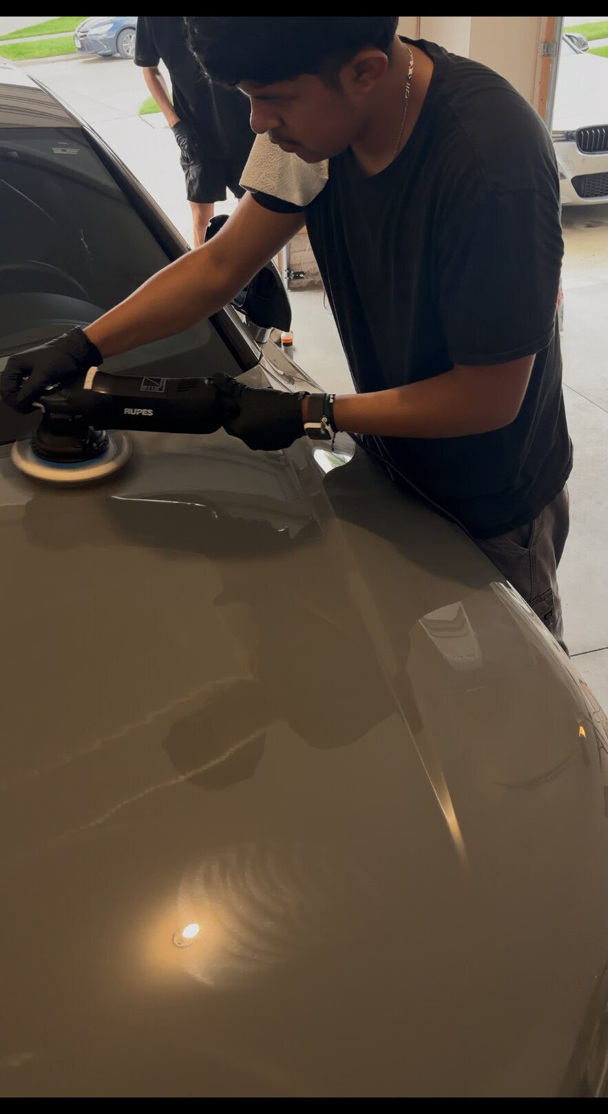Machine polishing the hood of the Nardo Grey Audi RS7 before ceramic coating