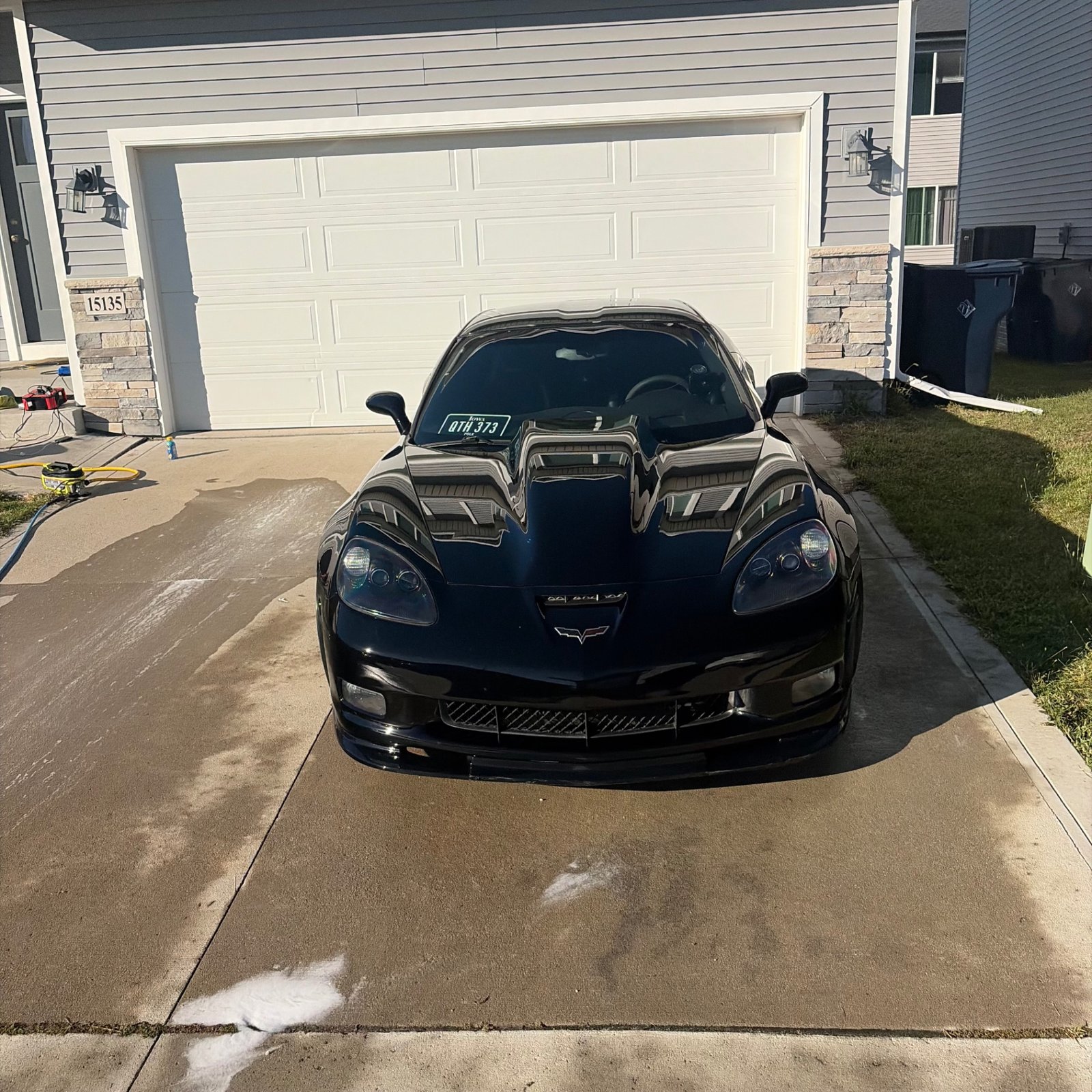 Black Corvette C6 Z06 straight-on front view after the exterior detail in Urbandale