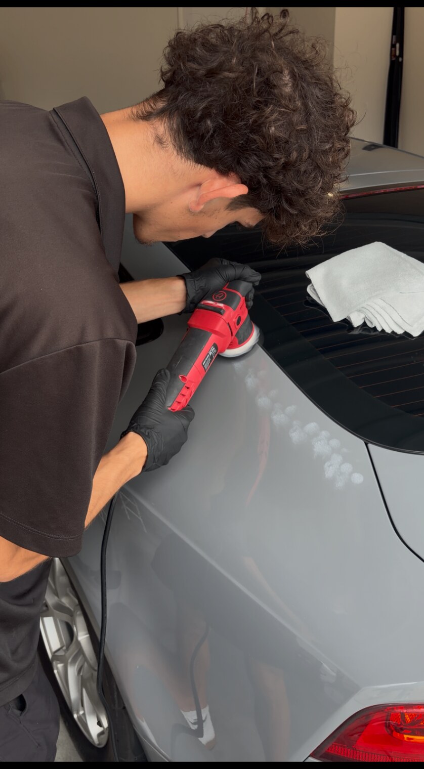 Machine polishing an Audi RS7 during paint correction