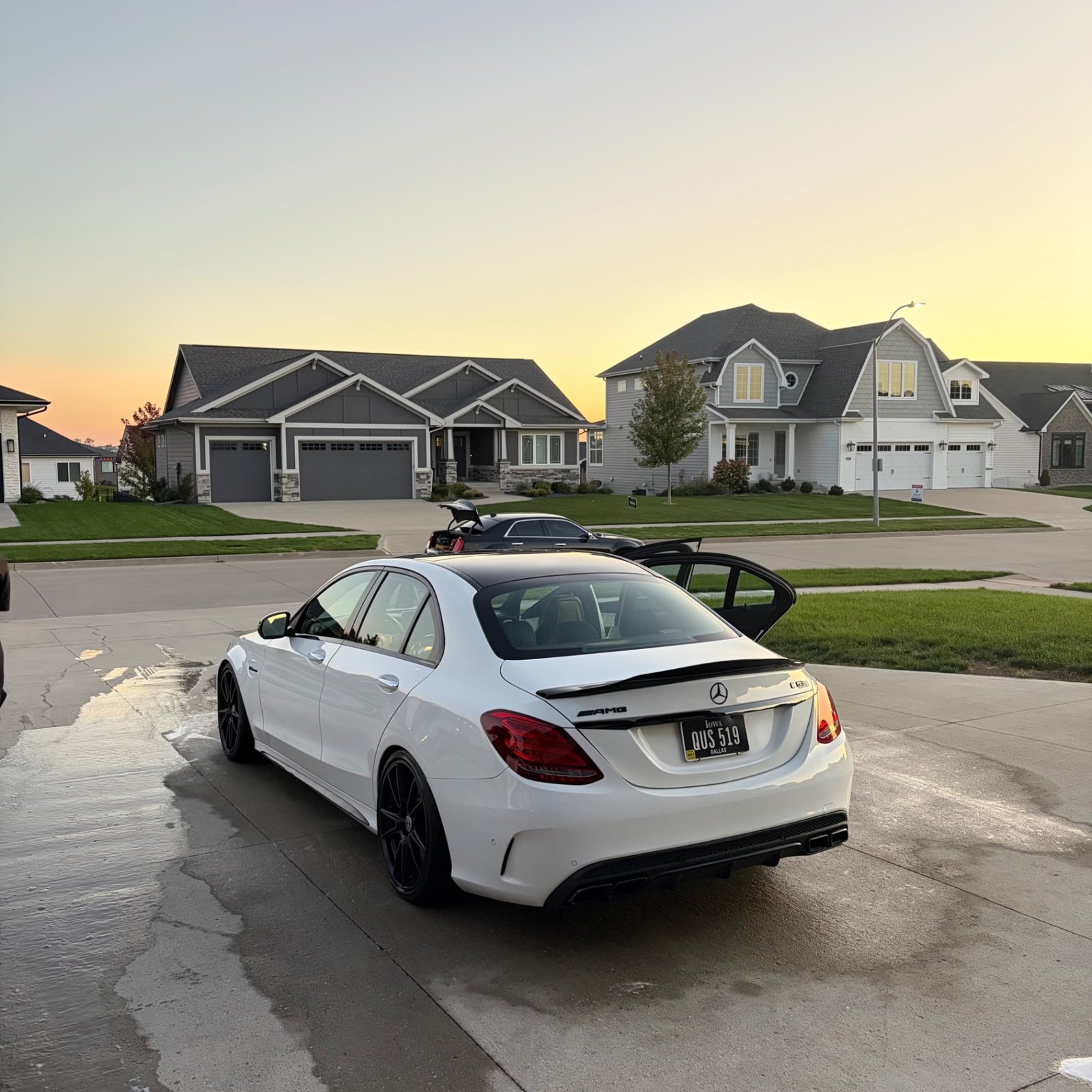 White Mercedes-AMG C 63 S on HRE wheels at sunset after its Waukee exterior detail