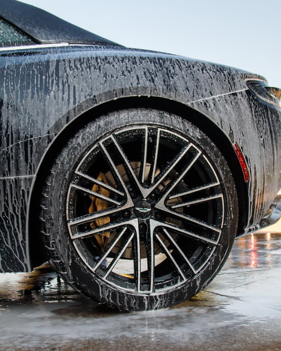 Aston Martin being detailed wheel by Street Standard Detailing in the Des Moines metro